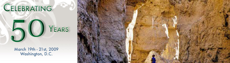 Celebrating 50 years, 3/19-3/21, 2009. A man looking up at giant canyon walls